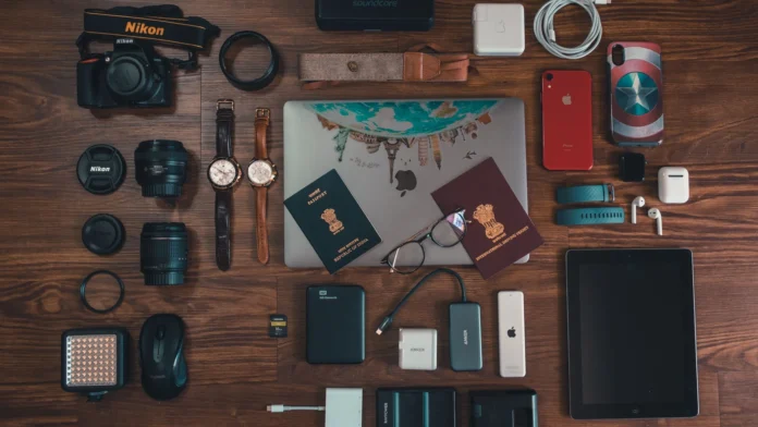 Passports, power bank and electronic travel accessories laid out for packing